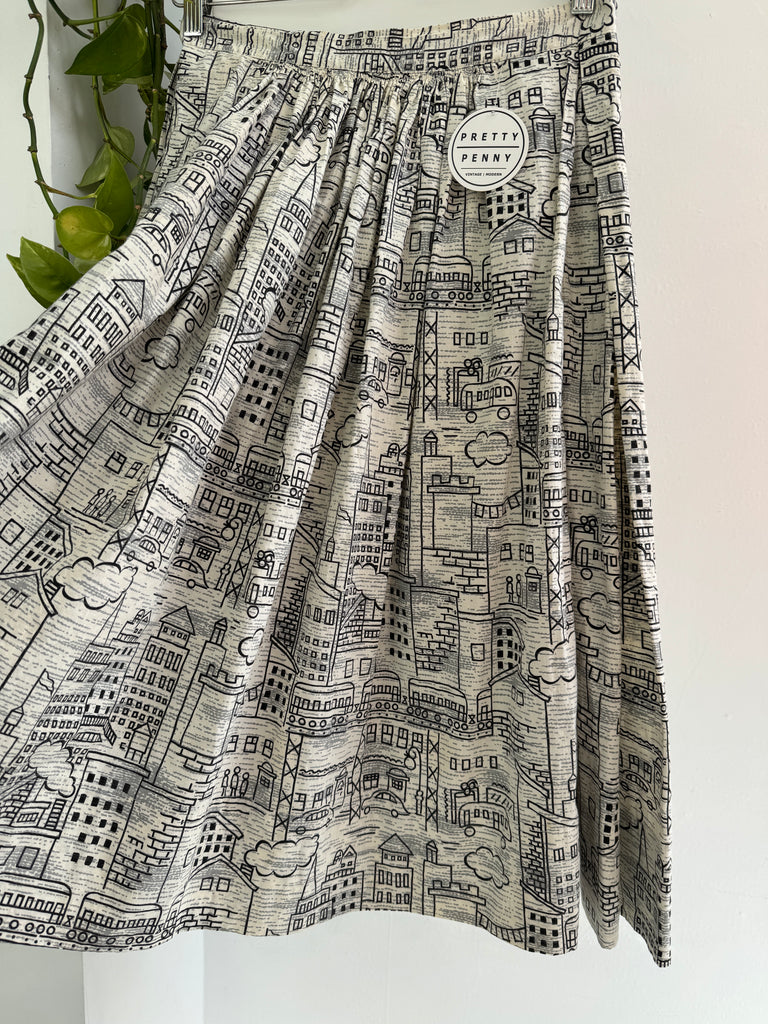 Vintage city scene novelty print skirt “28/29”