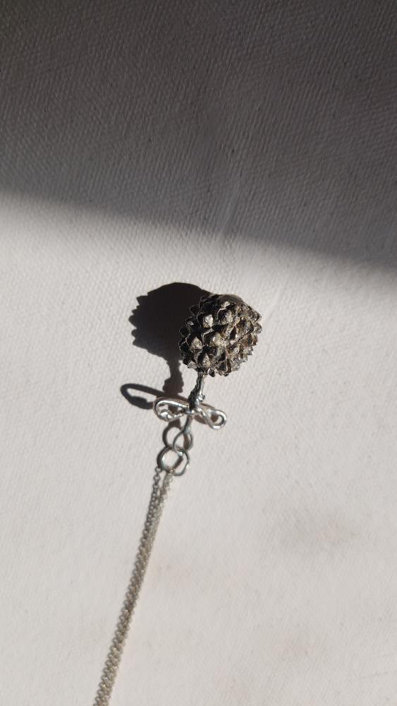 Vintage artisan sterling dandelion bow pendant