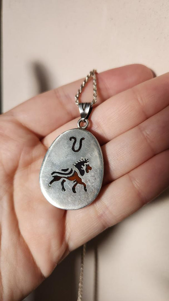Vintage sterling Leo zodiac pendant