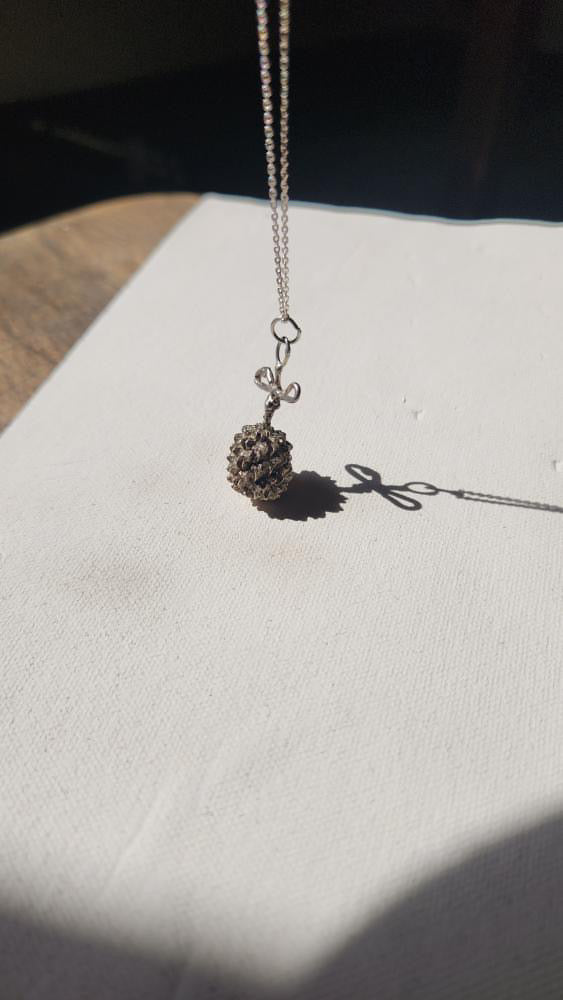 Vintage artisan sterling dandelion bow pendant