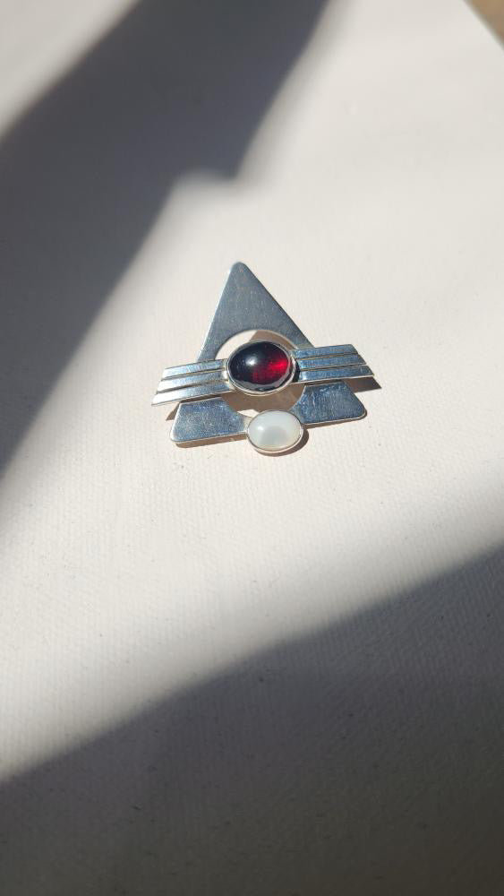 Vintage modernist pin with garnet stone