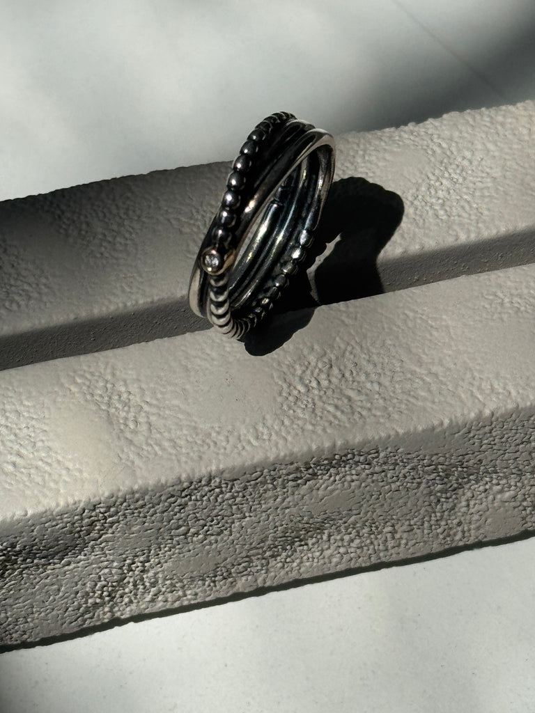 Sterling silver band with 14kt gold + tiny diamond size 6.5