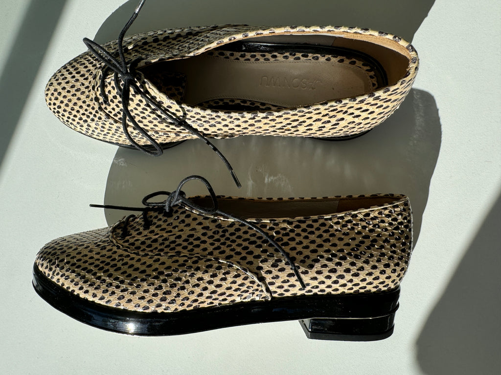 Designer Jason Wu snake skin shoes
