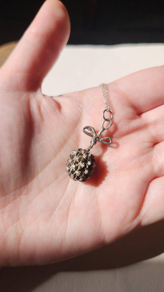 Vintage artisan sterling dandelion bow pendant