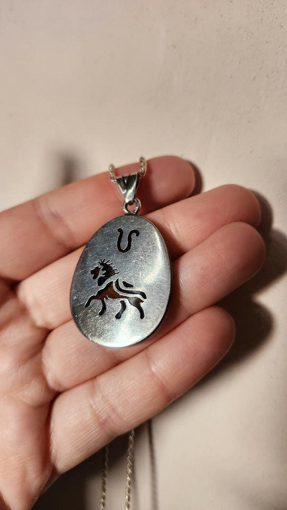 Vintage sterling Leo zodiac pendant