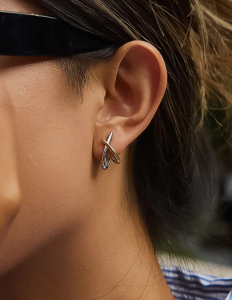 Two toned cross over earrings