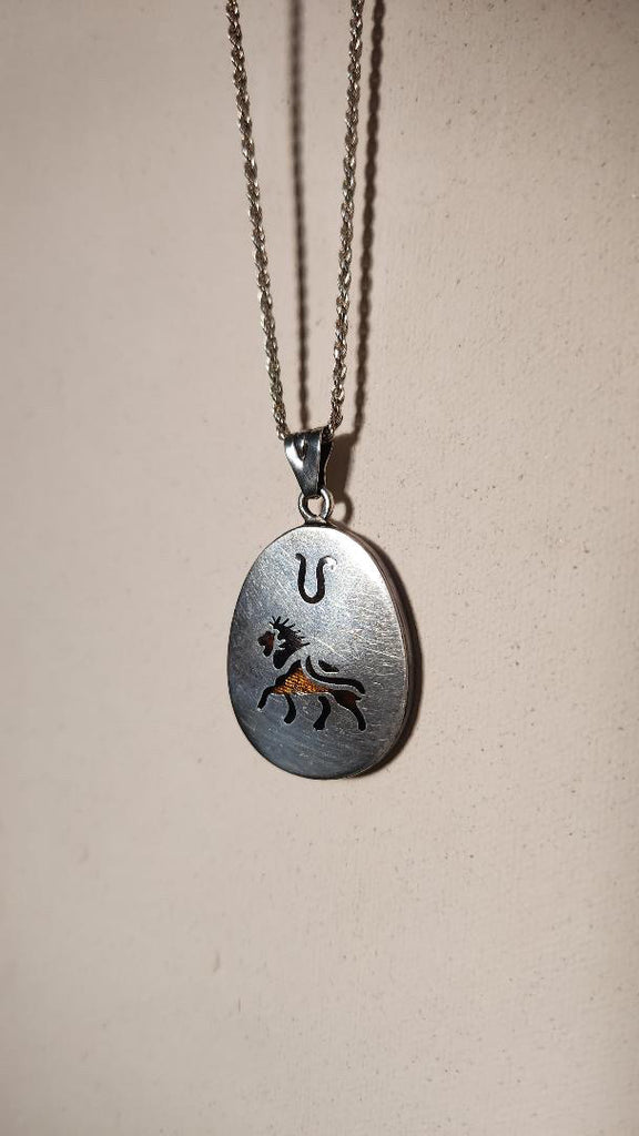 Vintage sterling Leo zodiac pendant