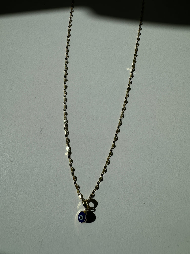 Evil eye pendant and gold chain necklace