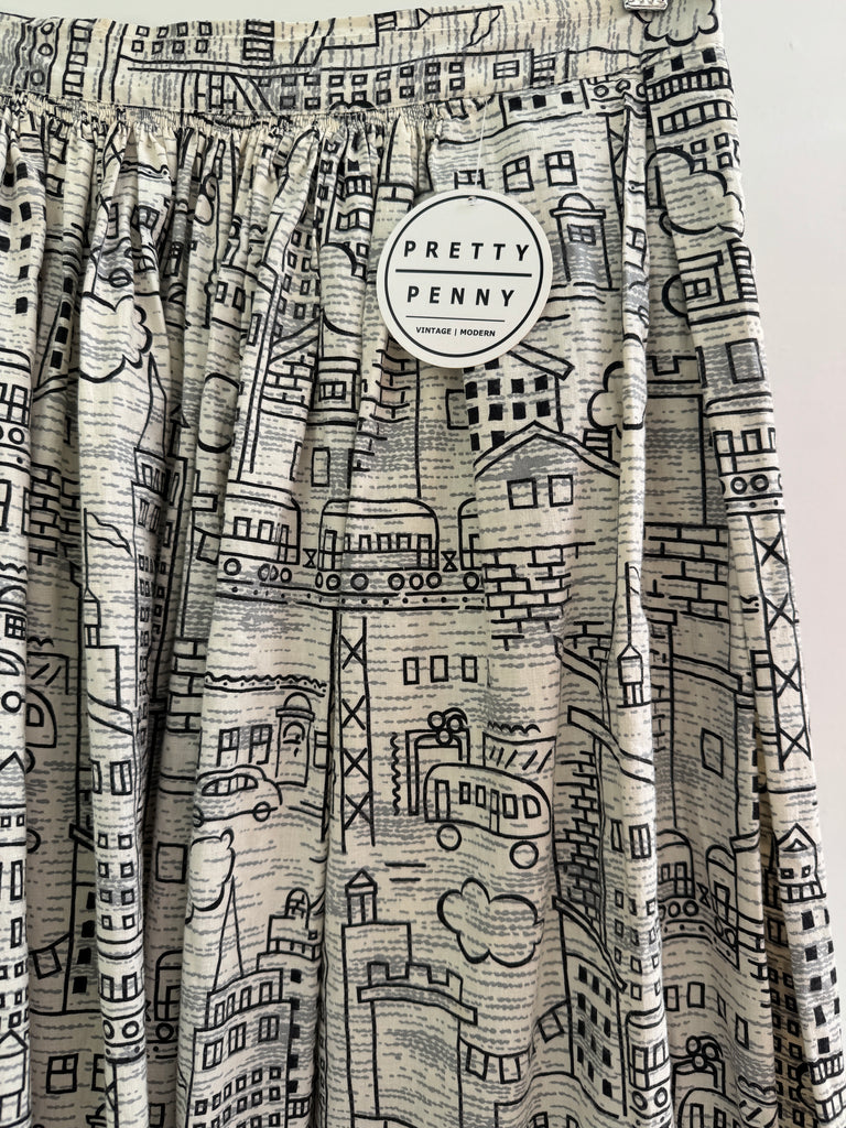 Vintage city scene novelty print skirt “28/29”