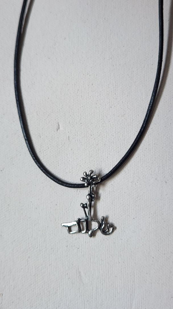 Vintage abstract artisan pendant on cord