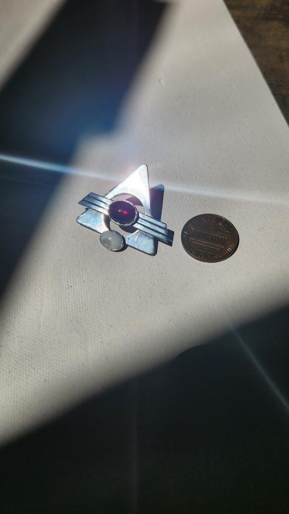 Vintage modernist pin with garnet stone