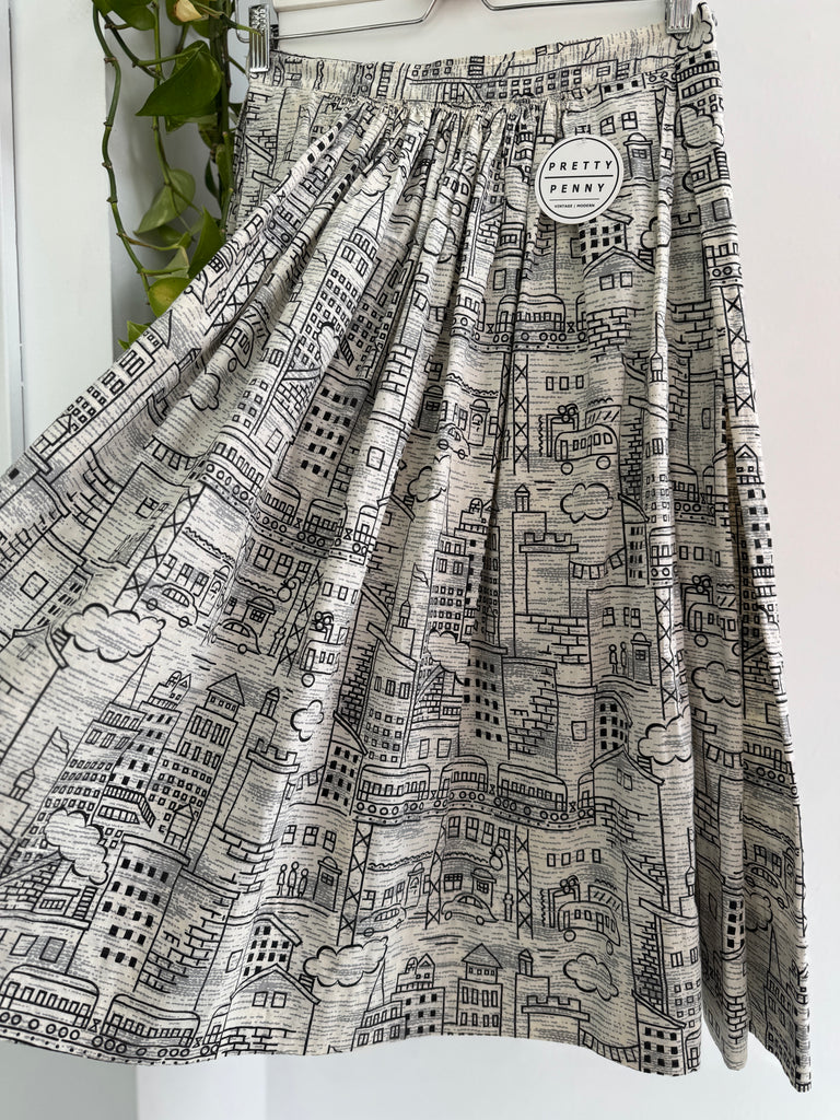 Vintage city scene novelty print skirt “28/29”