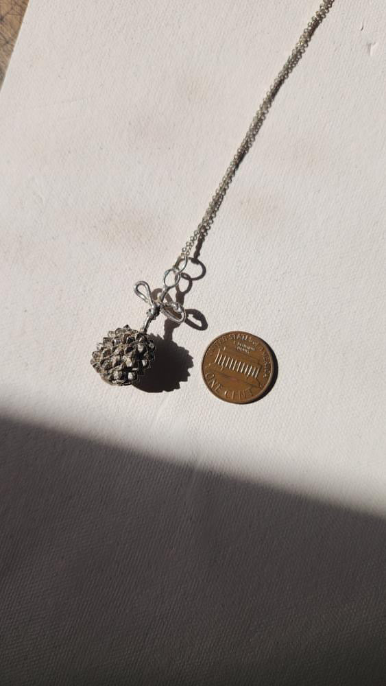 Vintage artisan sterling dandelion bow pendant