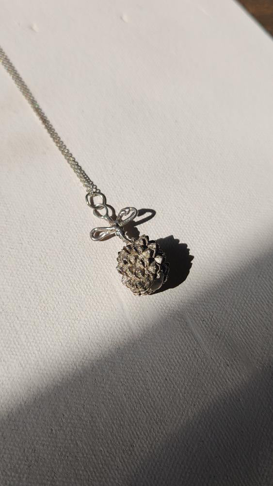 Vintage artisan sterling dandelion bow pendant