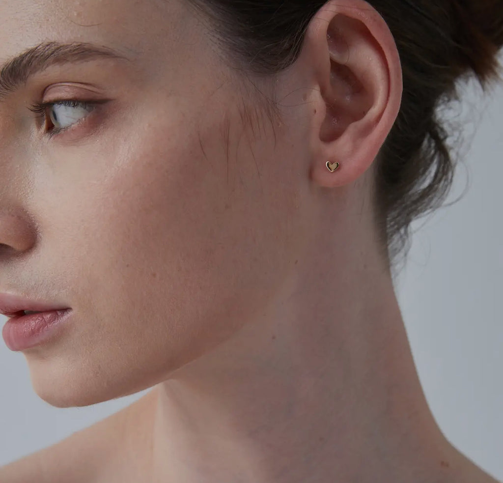 Dainty tiny heart post earrings. Gold plating
